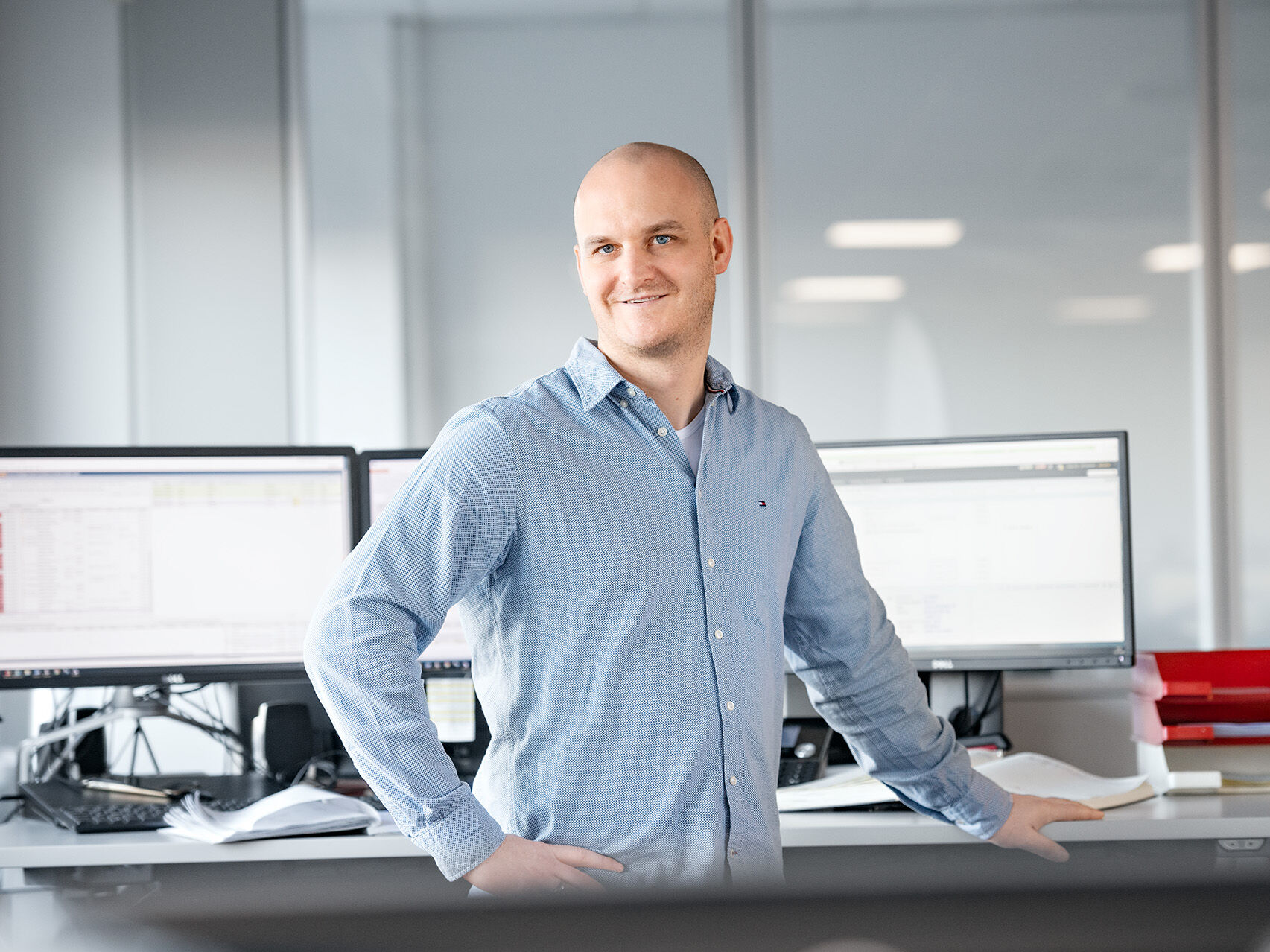 Safety HOYER employee standing infront of a desk