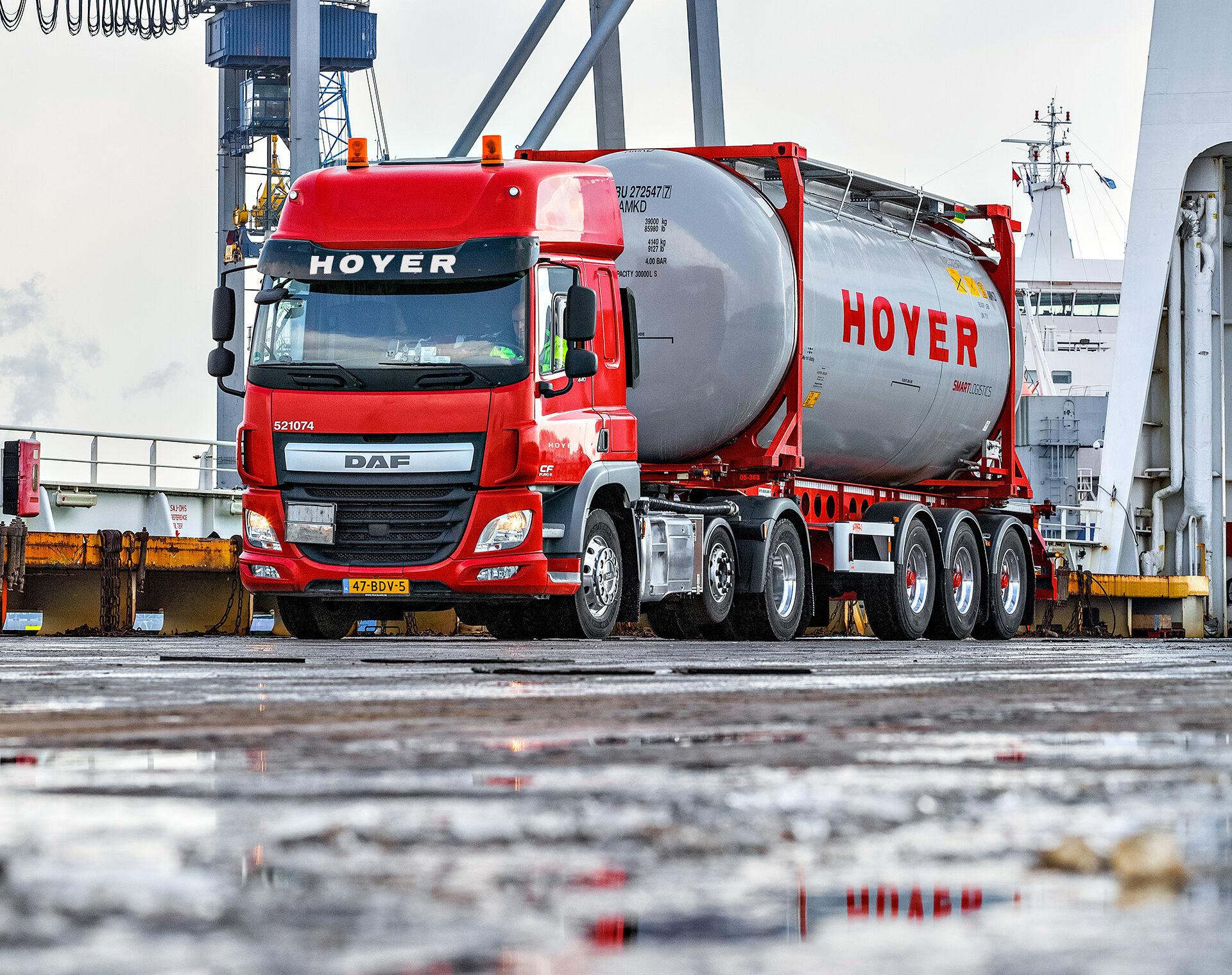 HOYER truck with smart logistics tank container at the harbour in Rotterdam